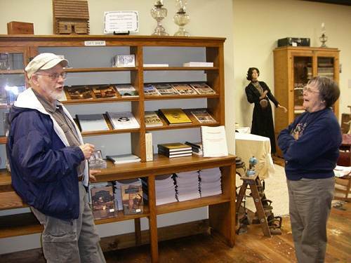 27 Dwight and Nancy Thompson discussing Dwight's Books