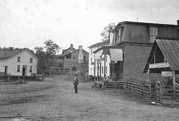 02 River Front Street in Tuscumbia - Hauenstein and Fendorf Stores - George Swanson Postmaster Standing