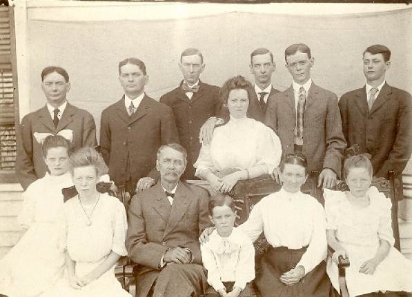 09 James Martin Family Upper Row: Ed, Carrol, Clint, Clate, Phil, Perry and Lena Lower Row: Nellie, Cora, James, Ted, Julia and Nancy