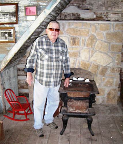 24 Carl McDonald beside Lupardus Cabin Stove