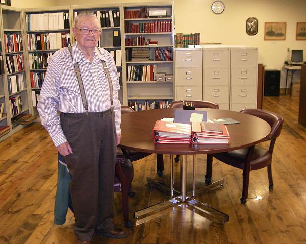 32a Dr. Lyle Hensley with Donated Records for Museum Library