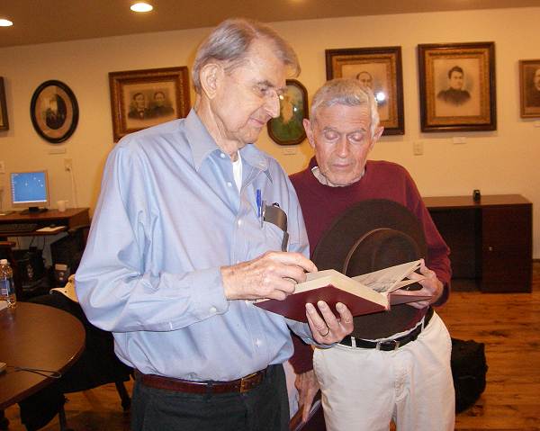 05 John and Gerard Schultz Jr. holding book written by their Father