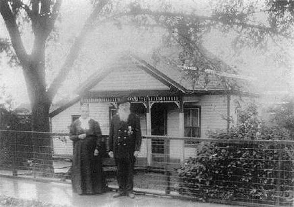 07 John and Dorcas Ferguson in front of Home