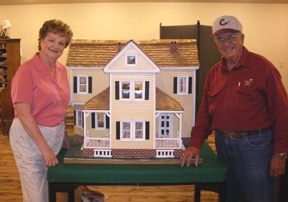 16 Dr. and Mrs. Haggerty with Miniature Home