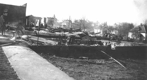  The first building is the dentists office and the garage is above that.  The steeple of the Baptist Church can be seen in the distance. 