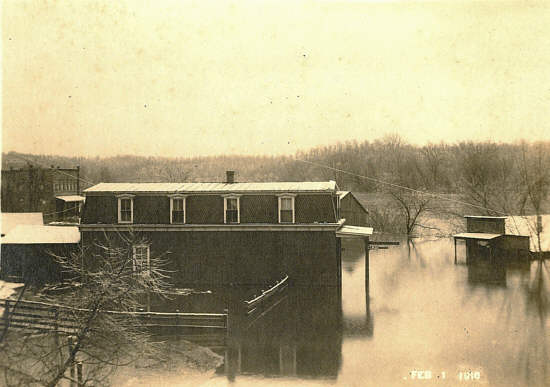 27 Fendorf building left, Johnson building right during a flood
