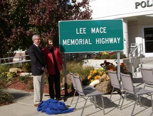 03 Gene Williams and Joyce Mace by Uncovered Road Sign