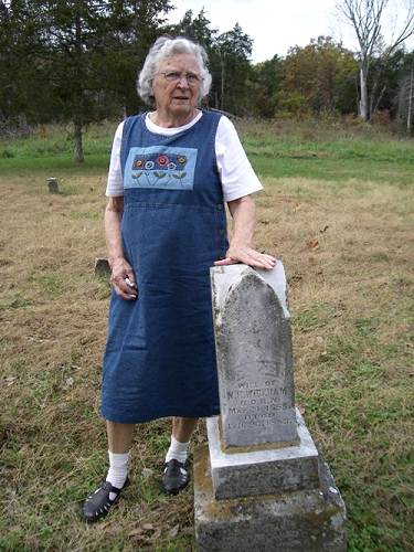 22 Elva Boyd Steen standing next to Tombstone of Her Great Grandmother
